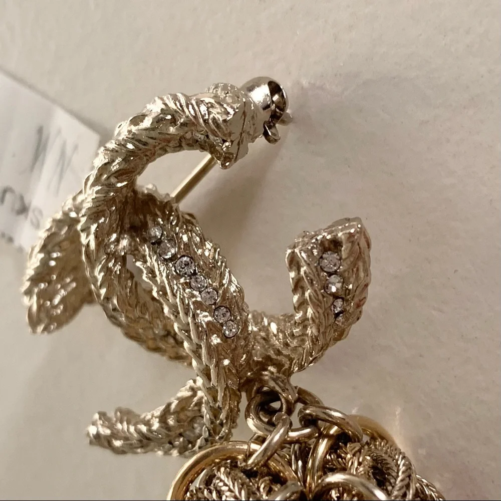 Chanel large tassel brooch in gold with crystals